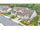 Charming townhome with a stone-accented facade, attached garage, and well-manicured landscaping at 2047 Winterset Dr, Lakeland, FL 33813