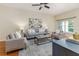 Well-decorated living room featuring a comfortable sofa, stylish chairs, and a chic coffee table at 2047 Winterset Dr, Lakeland, FL 33813