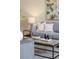 Cozy living room featuring a gray sofa, marble table, and modern decor at 2047 Winterset Dr, Lakeland, FL 33813