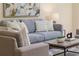 Close-up of the living room's comfortable sofa, stylish chairs, and decorative coffee table at 2047 Winterset Dr, Lakeland, FL 33813
