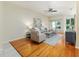Bright and airy living room with hardwood floors, neutral decor, and ample natural light at 2047 Winterset Dr, Lakeland, FL 33813