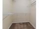 Spacious walk-in closet features carpeted floors and plenty of shelving for organization at 2047 Winterset Dr, Lakeland, FL 33813