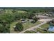 Scenic aerial view of the property showcasing its expansive land, buildings, and peaceful setting at 2145 Limedale Rd, Lakeland, FL 33809