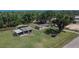 Wide aerial view of the property showing the house, garage, trampoline, and extensive yard at 2145 Limedale Rd, Lakeland, FL 33809