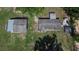 High aerial view showcasing the roofline, landscaping, and various outbuildings on the property at 2145 Limedale Rd, Lakeland, FL 33809