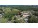 Expansive aerial view of property showing home, outbuildings, and surrounding landscape with treed areas at 2145 Limedale Rd, Lakeland, FL 33809