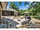 Outdoor patio area with a fire pit and sitting area at 2145 Limedale Rd, Lakeland, FL 33809