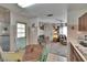 Inviting kitchen with eat-in area adjacent to the living room and stainless refrigerator at 2145 Limedale Rd, Lakeland, FL 33809