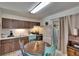 Cozy eat-in kitchen features a classic design with wood cabinets and vintage charm at 2145 Limedale Rd, Lakeland, FL 33809