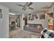 Inviting living room with carpet, kitchen access, deer heads, and a comfortable sofa at 2145 Limedale Rd, Lakeland, FL 33809