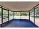 Spacious screened porch with views of the backyard, perfect for outdoor relaxation and entertaining guests at 2145 Limedale Rd, Lakeland, FL 33809