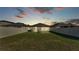 Fenced backyard featuring a well-manicured lawn, perfect for outdoor activities and relaxation at 2293 Caspian Dr, Lakeland, FL 33805