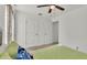 This bedroom features neutral carpet, fresh paint, and a ceiling fan for added comfort at 2293 Caspian Dr, Lakeland, FL 33805