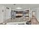 Beautiful kitchen showcasing granite countertops, dark wood cabinets, and stainless appliances at 2293 Caspian Dr, Lakeland, FL 33805