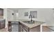 Kitchen with granite countertop island and stainless dishwasher at 2293 Caspian Dr, Lakeland, FL 33805