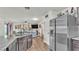 Open-concept kitchen with granite countertops and a view of the living area at 2293 Caspian Dr, Lakeland, FL 33805