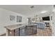 A modern kitchen features granite counters, a stainless dishwasher and views to living area at 2293 Caspian Dr, Lakeland, FL 33805
