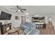 Open-concept living room with stylish furniture, fireplace, and views to the kitchen at 2293 Caspian Dr, Lakeland, FL 33805