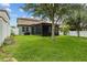 This house features a lush backyard with a screened lanai and a lovely view at 2317 Bella Luna Cir, Lakeland, FL 33810