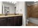 Bathroom featuring a double vanity with granite countertops and tile flooring at 2317 Bella Luna Cir, Lakeland, FL 33810