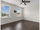 Bedroom featuring a ceiling fan and two windows letting in natural light at 2317 Bella Luna Cir, Lakeland, FL 33810