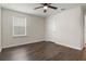 Bedroom features include modern flooring, a ceiling fan, a window, and a closet at 2317 Bella Luna Cir, Lakeland, FL 33810