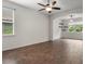 Bonus room featuring wood floors, arched entryway, and an abundance of natural light at 2317 Bella Luna Cir, Lakeland, FL 33810