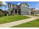 Inviting home showcasing manicured lawn, mulched garden beds, and a spacious two-car garage at 2317 Bella Luna Cir, Lakeland, FL 33810