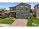 Charming home featuring a well maintained lawn, beautiful landscaping and a two-car garage at 2317 Bella Luna Cir, Lakeland, FL 33810