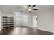 Bright living room featuring updated flooring, a ceiling fan, and neutral paint at 2317 Bella Luna Cir, Lakeland, FL 33810