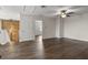 Open living room showcasing new flooring and a reclaimed wood accent wall by the staircase at 2317 Bella Luna Cir, Lakeland, FL 33810