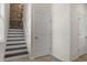 View of the staircase featuring dark wood steps and a unique, reclaimed wood accent wall at 2317 Bella Luna Cir, Lakeland, FL 33810