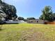 Expansive backyard with well-maintained lawn bordered by white vinyl and wood fencing at 2323 Ridgeview Dr, Lakeland, FL 33810