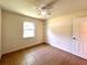 Bedroom showcasing tile flooring, a window with natural light, and closet for storage at 2323 Ridgeview Dr, Lakeland, FL 33810