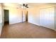 Bedroom features tile flooring, closet space, and doorway to a bathroom at 2323 Ridgeview Dr, Lakeland, FL 33810
