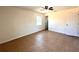Bedroom featuring tiled flooring, a ceiling fan, and a window providing natural light at 2323 Ridgeview Dr, Lakeland, FL 33810