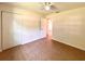 View of a bedroom featuring tiled floors, closet space, and a ceiling fan at 2323 Ridgeview Dr, Lakeland, FL 33810