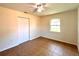Bedroom displaying tile flooring, a ceiling fan, window, and closet at 2323 Ridgeview Dr, Lakeland, FL 33810