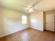 Bedroom with tiled floors, natural light from a window, and ceiling fan at 2323 Ridgeview Dr, Lakeland, FL 33810