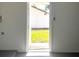 Open doorway from basement showing grassy backyard and bright daylight at 2323 Ridgeview Dr, Lakeland, FL 33810
