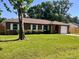 Well-maintained brick home with green lawn and a quaint, inviting appeal at 2323 Ridgeview Dr, Lakeland, FL 33810