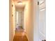 Bright hallway featuring white doors and tile flooring at 2323 Ridgeview Dr, Lakeland, FL 33810