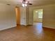 Bright living room with neutral walls, ceiling fan, and tile flooring at 2323 Ridgeview Dr, Lakeland, FL 33810