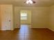 Open living room with tile flooring offers clear views of adjacent rooms at 2323 Ridgeview Dr, Lakeland, FL 33810