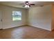 Inviting living room with tile floors and natural light from a bright window at 2323 Ridgeview Dr, Lakeland, FL 33810