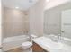 Bathroom with a tub, and sink with a bright mirror at 2343 Northumberland Ct, Haines City, FL 33844