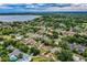 Stunning aerial view showcasing a charming neighborhood with mature trees and serene lake views at 2710 Fairmount Ave, Lakeland, FL 33803