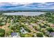 Expansive aerial view of the neighborhood with a beautiful lake and lush green landscape at 2710 Fairmount Ave, Lakeland, FL 33803