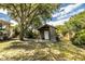 Backyard with detached shed and large shade tree at 2710 Fairmount Ave, Lakeland, FL 33803