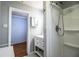 Bathroom with a walk in shower, vanity and a view into a walk in closet at 2710 Fairmount Ave, Lakeland, FL 33803